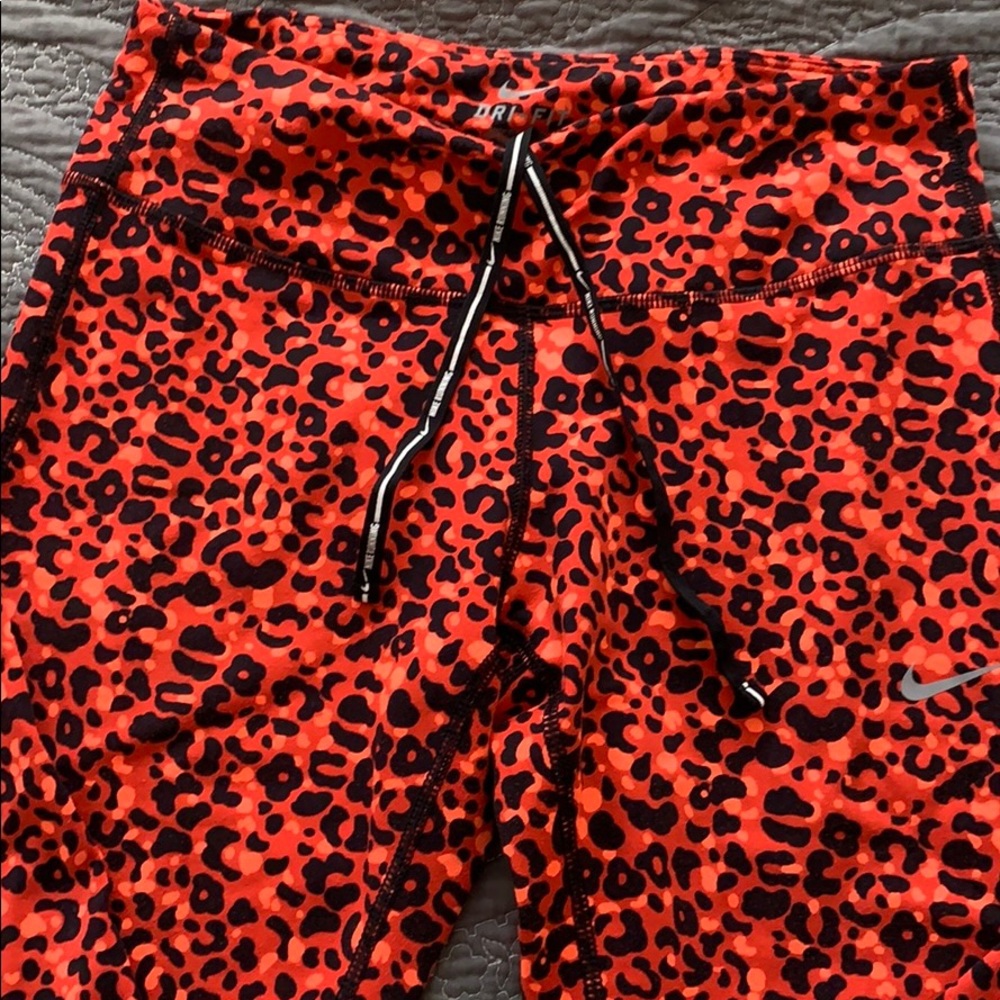 Like New running pants. Orange leopard print.